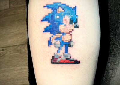 A Tattoo of a Pixelated Sonic the Hedgehog in full colour